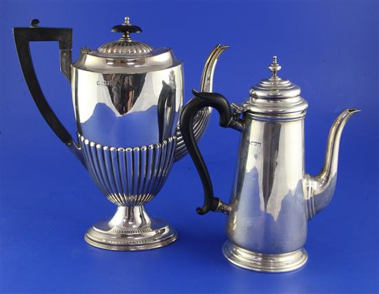 Two early 20th century silver coffee pots, gross 35 oz.